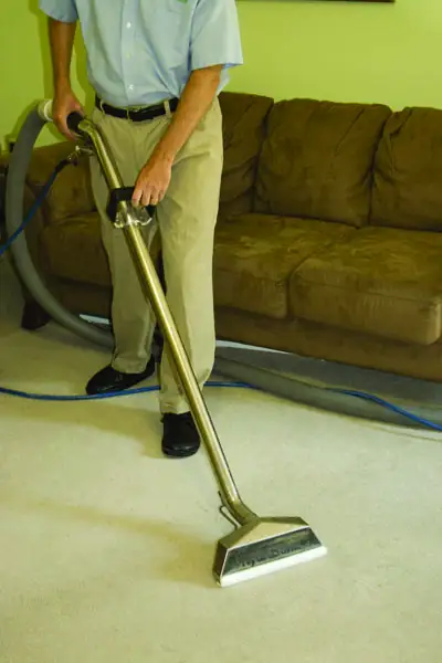 Hot water extraction cleaning a residential carpet